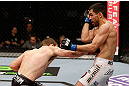 LONDON, ENGLAND - FEBRUARY 16:  (L-R) Phil Harris punches Ulysses Gomez in their flyweight fight during the UFC on Fuel TV event on February 16, 2013 at Wembley Arena in London, England.  (Photo by Josh Hedges/Zuffa LLC/Zuffa LLC via Getty Images)
