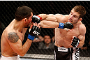 LONDON, ENGLAND - FEBRUARY 16:  (R-L) Phil Harris punches Ulysses Gomez in their flyweight fight during the UFC on Fuel TV event on February 16, 2013 at Wembley Arena in London, England.  (Photo by Josh Hedges/Zuffa LLC/Zuffa LLC via Getty Images)