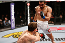 LONDON, ENGLAND - FEBRUARY 16:  (R-L) Ulysses Gomez delivers a flying knee against Phil Harris in their flyweight fight during the UFC on Fuel TV event on February 16, 2013 at Wembley Arena in London, England.  (Photo by Josh Hedges/Zuffa LLC/Zuffa LLC via Getty Images)