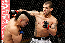 LONDON, ENGLAND - FEBRUARY 16:  (R-L) Vaughan Lee punches Motonobu Tezuka in their bantamweight fight during the UFC on Fuel TV event on February 16, 2013 at Wembley Arena in London, England.  (Photo by Josh Hedges/Zuffa LLC/Zuffa LLC via Getty Images)