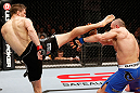 LONDON, ENGLAND - FEBRUARY 16:  (L-R) Tom Watson kicks Stanislav Nedkov in their middleweight fight during the UFC on Fuel TV event on February 16, 2013 at Wembley Arena in London, England.  (Photo by Josh Hedges/Zuffa LLC/Zuffa LLC via Getty Images)