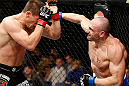 LONDON, ENGLAND - FEBRUARY 16:  (R-L) Stanislav Nedkov punches Tom Watson in their middleweight fight during the UFC on Fuel TV event on February 16, 2013 at Wembley Arena in London, England.  (Photo by Josh Hedges/Zuffa LLC/Zuffa LLC via Getty Images)