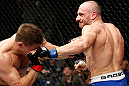 LONDON, ENGLAND - FEBRUARY 16:  (R-L) Stanislav Nedkov punches Tom Watson in their middleweight fight during the UFC on Fuel TV event on February 16, 2013 at Wembley Arena in London, England.  (Photo by Josh Hedges/Zuffa LLC/Zuffa LLC via Getty Images)