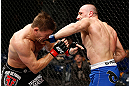 LONDON, ENGLAND - FEBRUARY 16:  (R-L) Stanislav Nedkov punches Tom Watson in their middleweight fight during the UFC on Fuel TV event on February 16, 2013 at Wembley Arena in London, England.  (Photo by Josh Hedges/Zuffa LLC/Zuffa LLC via Getty Images)