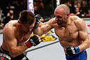 LONDON, ENGLAND - FEBRUARY 16:  (R-L) Stanislav Nedkov punches Tom Watson in their middleweight fight during the UFC on Fuel TV event on February 16, 2013 at Wembley Arena in London, England.  (Photo by Josh Hedges/Zuffa LLC/Zuffa LLC via Getty Images)