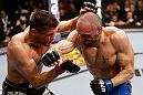 LONDON, ENGLAND - FEBRUARY 16:  (R-L) Stanislav Nedkov punches Tom Watson in their middleweight fight during the UFC on Fuel TV event on February 16, 2013 at Wembley Arena in London, England.  (Photo by Josh Hedges/Zuffa LLC/Zuffa LLC via Getty Images)