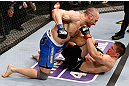 LONDON, ENGLAND - FEBRUARY 16:  (L-R) Stanislav Nedkov punches Tom Watson in their middleweight fight during the UFC on Fuel TV event on February 16, 2013 at Wembley Arena in London, England.  (Photo by Josh Hedges/Zuffa LLC/Zuffa LLC via Getty Images)