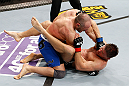 LONDON, ENGLAND - FEBRUARY 16:  (L-R) Stanislav Nedkov punches Tom Watson in their middleweight fight during the UFC on Fuel TV event on February 16, 2013 at Wembley Arena in London, England.  (Photo by Josh Hedges/Zuffa LLC/Zuffa LLC via Getty Images)
