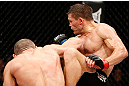 LONDON, ENGLAND - FEBRUARY 16:  (L-R) Stanislav Nedkov punches Tom Watson in their middleweight fight during the UFC on Fuel TV event on February 16, 2013 at Wembley Arena in London, England.  (Photo by Josh Hedges/Zuffa LLC/Zuffa LLC via Getty Images)