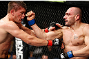 LONDON, ENGLAND - FEBRUARY 16:  (R-L) Stanislav Nedkov punches Tom Watson in their middleweight fight during the UFC on Fuel TV event on February 16, 2013 at Wembley Arena in London, England.  (Photo by Josh Hedges/Zuffa LLC/Zuffa LLC via Getty Images)