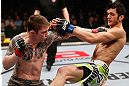 LONDON, ENGLAND - FEBRUARY 16:   (L-R) Andy Ogle punches Josh Grispi in their featherweight fight during the UFC on Fuel TV event on February 16, 2013 at Wembley Arena in London, England.  (Photo by Josh Hedges/Zuffa LLC/Zuffa LLC via Getty Images)