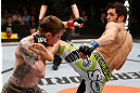 LONDON, ENGLAND - FEBRUARY 16:  (R-L) Josh Grispi kicks Andy Ogle in their featherweight fight during the UFC on Fuel TV event on February 16, 2013 at Wembley Arena in London, England.  (Photo by Josh Hedges/Zuffa LLC/Zuffa LLC via Getty Images)
