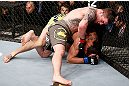 LONDON, ENGLAND - FEBRUARY 16:  (L-R) Andy Ogle punches Josh Grispi in their featherweight fight during the UFC on Fuel TV event on February 16, 2013 at Wembley Arena in London, England.  (Photo by Josh Hedges/Zuffa LLC/Zuffa LLC via Getty Images)