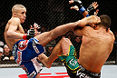 LONDON, ENGLAND - FEBRUARY 16:  (L-R) Terry Etim kicks Renee Forte in their lightweight fight during the UFC on Fuel TV event on February 16, 2013 at Wembley Arena in London, England.  (Photo by Josh Hedges/Zuffa LLC/Zuffa LLC via Getty Images)