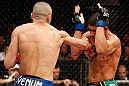 LONDON, ENGLAND - FEBRUARY 16:  (L-R) Terry Etim punches Renee Forte in their lightweight fight during the UFC on Fuel TV event on February 16, 2013 at Wembley Arena in London, England.  (Photo by Josh Hedges/Zuffa LLC/Zuffa LLC via Getty Images)