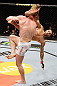 LONDON, ENGLAND - FEBRUARY 16:  (R-L) Che Mills kicks Matthew Riddle after a takedown in their welterweight fight during the UFC on Fuel TV event on February 16, 2013 at Wembley Arena in London, England.  (Photo by Josh Hedges/Zuffa LLC/Zuffa LLC via Getty Images)