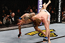 LONDON, ENGLAND - FEBRUARY 16:  (L-R) Che Mills attempts to throw Matthew Riddle to the mat in their welterweight fight during the UFC on Fuel TV event on February 16, 2013 at Wembley Arena in London, England.  (Photo by Josh Hedges/Zuffa LLC/Zuffa LLC via Getty Images)