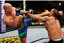 LONDON, ENGLAND - FEBRUARY 16:  (L-R) Ryan Jimmo kicks James Te Huna in their light heavyweight fight during the UFC on Fuel TV event on February 16, 2013 at Wembley Arena in London, England.  (Photo by Josh Hedges/Zuffa LLC/Zuffa LLC via Getty Images)