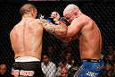 LONDON, ENGLAND - FEBRUARY 16:  (L-R) James Te Huna punches Ryan Jimmo in their light heavyweight fight during the UFC on Fuel TV event on February 16, 2013 at Wembley Arena in London, England.  (Photo by Josh Hedges/Zuffa LLC/Zuffa LLC via Getty Images)