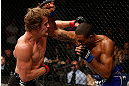 LONDON, ENGLAND - FEBRUARY 16:  (L-R) Gunnar Nelson punches Jorge Santiago in their welterweight fight during the UFC on Fuel TV event on February 16, 2013 at Wembley Arena in London, England.  (Photo by Josh Hedges/Zuffa LLC/Zuffa LLC via Getty Images)