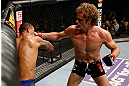 LONDON, ENGLAND - FEBRUARY 16:  (R-L) Gunnar Nelson punches Jorge Santiago in their welterweight fight during the UFC on Fuel TV event on February 16, 2013 at Wembley Arena in London, England.  (Photo by Josh Hedges/Zuffa LLC/Zuffa LLC via Getty Images)
