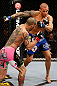 LONDON, ENGLAND - FEBRUARY 16:  (L-R) Cub Swanson punches Dustin Poirier in their featherweight fight during the UFC on Fuel TV event on February 16, 2013 at Wembley Arena in London, England.  (Photo by Josh Hedges/Zuffa LLC/Zuffa LLC via Getty Images)