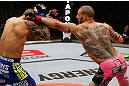 LONDON, ENGLAND - FEBRUARY 16:  (R-L) Cub Swanson punches Dustin Poirier in their featherweight fight during the UFC on Fuel TV event on February 16, 2013 at Wembley Arena in London, England.  (Photo by Josh Hedges/Zuffa LLC/Zuffa LLC via Getty Images)