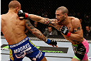 LONDON, ENGLAND - FEBRUARY 16:  (R-L) Cub Swanson punches Dustin Poirier in their featherweight fight during the UFC on Fuel TV event on February 16, 2013 at Wembley Arena in London, England.  (Photo by Josh Hedges/Zuffa LLC/Zuffa LLC via Getty Images)