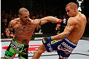 LONDON, ENGLAND - FEBRUARY 16:  (L-R) Cub Swanson punches Dustin Poirier in their featherweight fight during the UFC on Fuel TV event on February 16, 2013 at Wembley Arena in London, England.  (Photo by Josh Hedges/Zuffa LLC/Zuffa LLC via Getty Images)