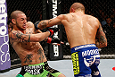 LONDON, ENGLAND - FEBRUARY 16:  (R-L) Dustin Poirier punches Cub Swanson in their featherweight fight during the UFC on Fuel TV event on February 16, 2013 at Wembley Arena in London, England.  (Photo by Josh Hedges/Zuffa LLC/Zuffa LLC via Getty Images)