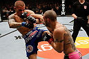 LONDON, ENGLAND - FEBRUARY 16:  (R-L) Cub Swanson punches Dustin Poirier in their featherweight fight during the UFC on Fuel TV event on February 16, 2013 at Wembley Arena in London, England.  (Photo by Josh Hedges/Zuffa LLC/Zuffa LLC via Getty Images)