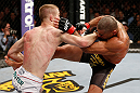 LONDON, ENGLAND - FEBRUARY 16:  (L-R) Michael McDonald punches Renan Barao in their interim bantamweight title fight during the UFC on Fuel TV event on February 16, 2013 at Wembley Arena in London, England.  (Photo by Josh Hedges/Zuffa LLC/Zuffa LLC via Getty Images)
