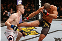 LONDON, ENGLAND - FEBRUARY 16:  (R-L) Renan Barao kicks Michael McDonald in their interim bantamweight title fight during the UFC on Fuel TV event on February 16, 2013 at Wembley Arena in London, England.  (Photo by Josh Hedges/Zuffa LLC/Zuffa LLC via Getty Images)