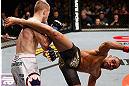 LONDON, ENGLAND - FEBRUARY 16:  (R-L) Renan Barao kicks Michael McDonald in their interim bantamweight title fight during the UFC on Fuel TV event on February 16, 2013 at Wembley Arena in London, England.  (Photo by Josh Hedges/Zuffa LLC/Zuffa LLC via Getty Images)