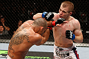 LONDON, ENGLAND - FEBRUARY 16:  (R-L) Michael McDonald punches Renan Barao in their interim bantamweight title fight during the UFC on Fuel TV event on February 16, 2013 at Wembley Arena in London, England.  (Photo by Josh Hedges/Zuffa LLC/Zuffa LLC via Getty Images)