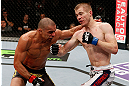 LONDON, ENGLAND - FEBRUARY 16:  (R-L) Michael McDonald punches Renan Barao in their interim bantamweight title fight during the UFC on Fuel TV event on February 16, 2013 at Wembley Arena in London, England.  (Photo by Josh Hedges/Zuffa LLC/Zuffa LLC via Getty Images)