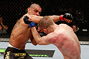 LONDON, ENGLAND - FEBRUARY 16:  (L-R) Renan Barao punches Michael McDonald in their interim bantamweight title fight during the UFC on Fuel TV event on February 16, 2013 at Wembley Arena in London, England.  (Photo by Josh Hedges/Zuffa LLC/Zuffa LLC via Getty Images)