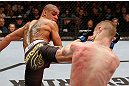 LONDON, ENGLAND - FEBRUARY 16:  (L-R) Renan Barao kicks Michael McDonald in their interim bantamweight title fight during the UFC on Fuel TV event on February 16, 2013 at Wembley Arena in London, England.  (Photo by Josh Hedges/Zuffa LLC/Zuffa LLC via Getty Images)