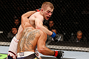 LONDON, ENGLAND - FEBRUARY 16:  (L-R) Michael McDonald punches Renan Barao in their interim bantamweight title fight during the UFC on Fuel TV event on February 16, 2013 at Wembley Arena in London, England.  (Photo by Josh Hedges/Zuffa LLC/Zuffa LLC via Getty Images)