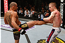 LONDON, ENGLAND - FEBRUARY 16:  (L-R) Renan Barao kicks Michael McDonald in their interim bantamweight title fight during the UFC on Fuel TV event on February 16, 2013 at Wembley Arena in London, England.  (Photo by Josh Hedges/Zuffa LLC/Zuffa LLC via Getty Images)