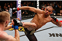 LONDON, ENGLAND - FEBRUARY 16:  (R-L) Renan Barao kicks Michael McDonald in their interim bantamweight title fight during the UFC on Fuel TV event on February 16, 2013 at Wembley Arena in London, England.  (Photo by Josh Hedges/Zuffa LLC/Zuffa LLC via Getty Images)