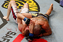 LONDON, ENGLAND - FEBRUARY 16:  (R-L) Renan Barao secures an arm triangle choke submission to defeat Michael McDonald in their interim bantamweight title fight during the UFC on Fuel TV event on February 16, 2013 at Wembley Arena in London, England.  (Photo by Josh Hedges/Zuffa LLC/Zuffa LLC via Getty Images)