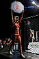 LONDON, ENGLAND - FEBRUARY 16:  UFC Octagon Girl Carly Baker introduces a round during the UFC on Fuel TV event on February 16, 2013 at Wembley Arena in London, England.  (Photo by Josh Hedges/Zuffa LLC/Zuffa LLC via Getty Images)