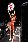 LONDON, ENGLAND - FEBRUARY 16:  UFC Octagon Girl Carly Baker introduces a round during the UFC on Fuel TV event on February 16, 2013 at Wembley Arena in London, England.  (Photo by Josh Hedges/Zuffa LLC/Zuffa LLC via Getty Images)