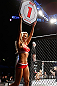LONDON, ENGLAND - FEBRUARY 16:  UFC Octagon Girl Carly Baker introduces a round during the UFC on Fuel TV event on February 16, 2013 at Wembley Arena in London, England.  (Photo by Josh Hedges/Zuffa LLC/Zuffa LLC via Getty Images)