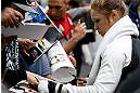 TORRANCE, CA - FEBRUARY 20:  Ronda Rousey signs autographs after an open training session for fans and media at the UFC Gym on February 20, 2013 in Torrance, California.  (Photo by Josh Hedges/Zuffa LLC/Zuffa LLC via Getty Images)