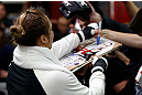 TORRANCE, CA - FEBRUARY 20:  Ronda Rousey signs autographs after an open training session for fans and media at the UFC Gym on February 20, 2013 in Torrance, California.  (Photo by Josh Hedges/Zuffa LLC/Zuffa LLC via Getty Images)