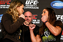 ANAHEIM, CA - FEBRUARY 21:  (L-R) Opponents Ronda Rousey and Liz Carmouche face off during a UFC pre-fight press conference at Honda Center on February 21, 2013 in Anaheim, California.  (Photo by Josh Hedges/Zuffa LLC/Zuffa LLC via Getty Images)