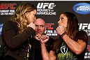 ANAHEIM, CA - FEBRUARY 21:  (L-R) Opponents Ronda Rousey and Liz Carmouche face off during a UFC pre-fight press conference at Honda Center on February 21, 2013 in Anaheim, California.  (Photo by Josh Hedges/Zuffa LLC/Zuffa LLC via Getty Images)
