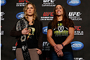 ANAHEIM, CA - FEBRUARY 21:  (L-R) Opponents Ronda Rousey and Liz Carmouche pose for photos during a UFC pre-fight press conference at Honda Center on February 21, 2013 in Anaheim, California.  (Photo by Josh Hedges/Zuffa LLC/Zuffa LLC via Getty Images)